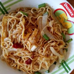 A picture of Lagman,noodle and vegetables.