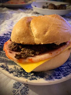 Una foto de Bocadillo de lomo con morcilla de cebolla y queso