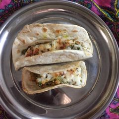 A picture of Tacos with peas.
