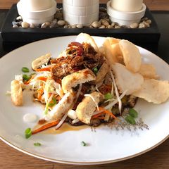 A picture of Indonesian tofu egg salad with spicy sweet soy dipping sauce (tahu telur sambal kecap).