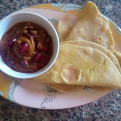 A picture of Tortillas(flat bread) with chilli con carne sauce.