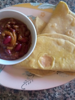A picture of Tortillas(flat bread) with chilli con carne sauce.