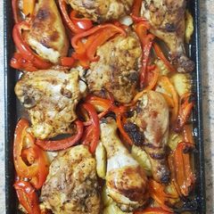 A picture of Baked chicken with pineapples and capsicums (bell pepper).