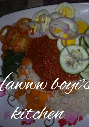 A picture of Rice and Tomato Stew with vegeatables.