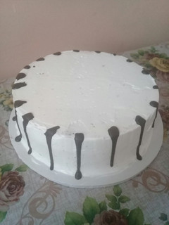 A picture of Icing the cake n trying out on chocolate drips#authormarathon.