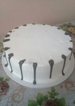 A picture of Icing the cake n trying out on chocolate drips#authormarathon.