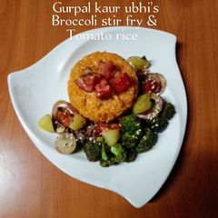 A picture of Broccoli stir fry & tomato rice 🥦🍅🍚.