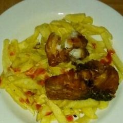 A picture of Chips and Fried Fish fillet.