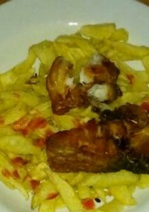 A picture of Chips and Fried Fish fillet.