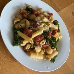 A picture of Pasta with Italian sausage & tender stem broccoli.
