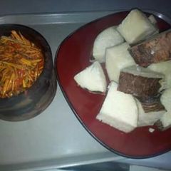 A picture of Boiled yam with ugba sauce.