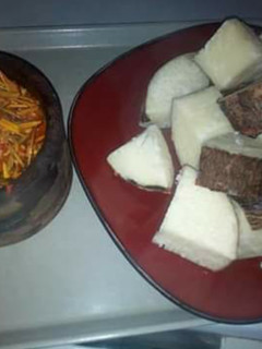 A picture of Boiled yam with ugba sauce.