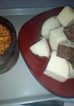 A picture of Boiled yam with ugba sauce.