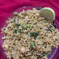 A picture of Satvik Green peas and Kabuli chanarice in pressure cooker.