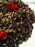 Risotto al nero di seppia con bottarga e pesto di pomodori secchi