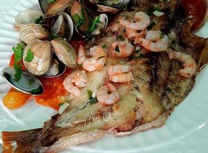 Una foto de Besugos al horno con vuelco de almejas a la cidra