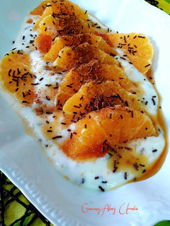 Una foto de Suspiros de naranja y Azahar con crema de yogur de vainilla