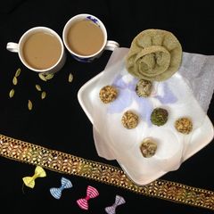 A picture of Dry fruits clusters with Elaichi tea.