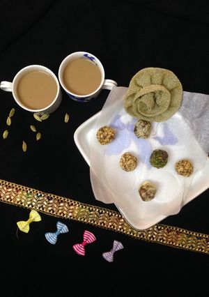 A picture of Dry fruits clusters with Elaichi tea.