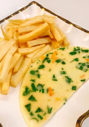 A picture of Yam fries and omelette.
