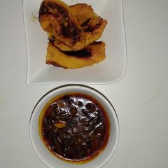 A picture of Pan Roast ripe plantain and crayfish sauce.