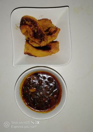 A picture of Pan Roast ripe plantain and crayfish sauce.