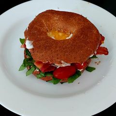 A picture of My Crispy Bacon on Wholemeal 🥯 with 🍅 and 🥚 also Spinach.