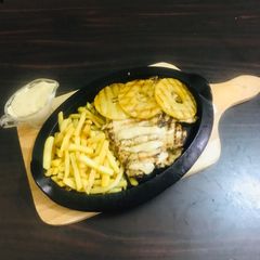 A picture of Chicken Hawaiian steak with pineapple 🍍.