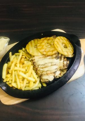 A picture of Chicken Hawaiian steak with pineapple 🍍.