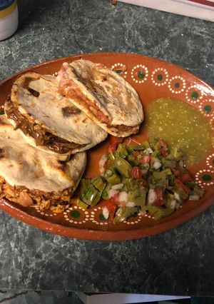 A picture of Stuffed Gorditas with Nopal Salad.