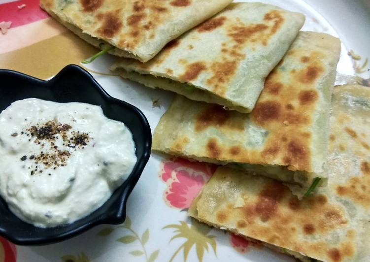 Aloo Afghani Bolani served with cheesy yogurt sauce