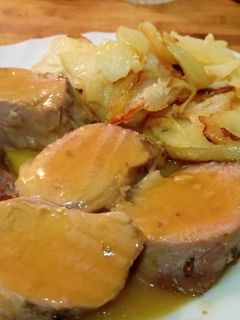 Una foto de Solomillo de cerdo con zumo de mandarina al horno