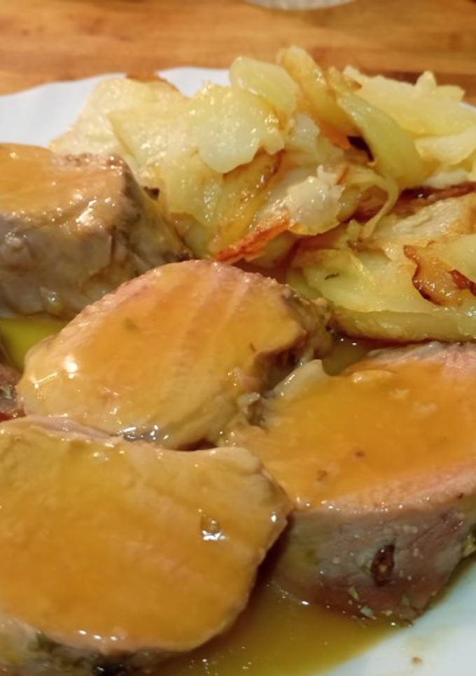 Una foto de Solomillo de cerdo con zumo de mandarina al horno