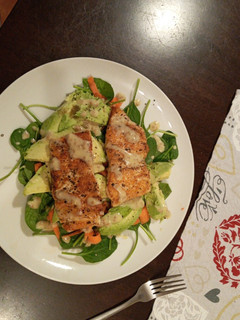 A picture of Pan fried salmon and avocado salad.