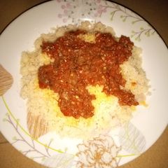 A picture of Plain steamed rice grits with beef stew.