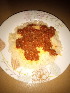 A picture of Plain steamed rice grits with beef stew.