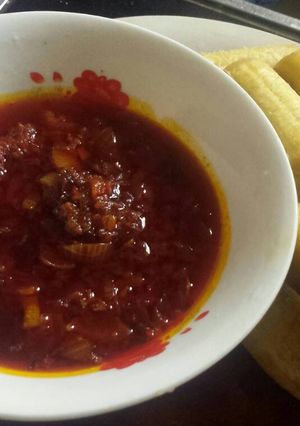 A picture of Palm oil sauce with plantain.