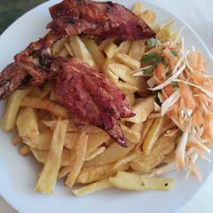 A picture of Fried chicken with fries.