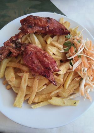 A picture of Fried chicken with fries.