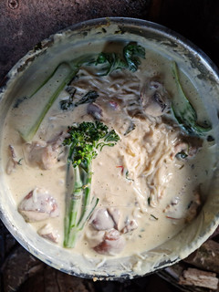 A picture of Thick chicken noodle soup.