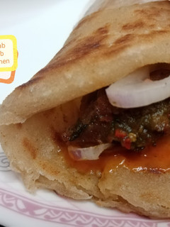A picture of Shami kabab roll paratha.