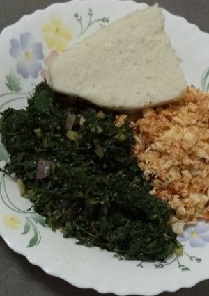 A picture of Ugali, Sukuma wiki with scrambled eggs.
