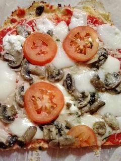 Una foto de Pizza vegetariana