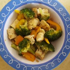A picture of Tofu with broccoli and pepper.
