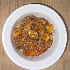 A picture of Sausage & Peppers Over Crispy Rosemary Potatoes.