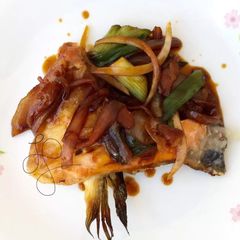 A picture of Salmon In Onion Peri Peri And Soy Sauce.