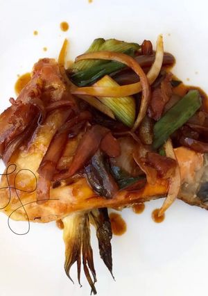A picture of Salmon In Onion Peri Peri And Soy Sauce.