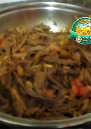 Una foto de Carne 🥩Desmechada con Guiso 🍅🧅