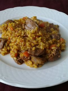 Una foto de Arroz meloso con higaditos de pollo