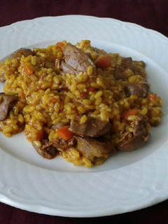 Una foto de Arroz meloso con higaditos de pollo